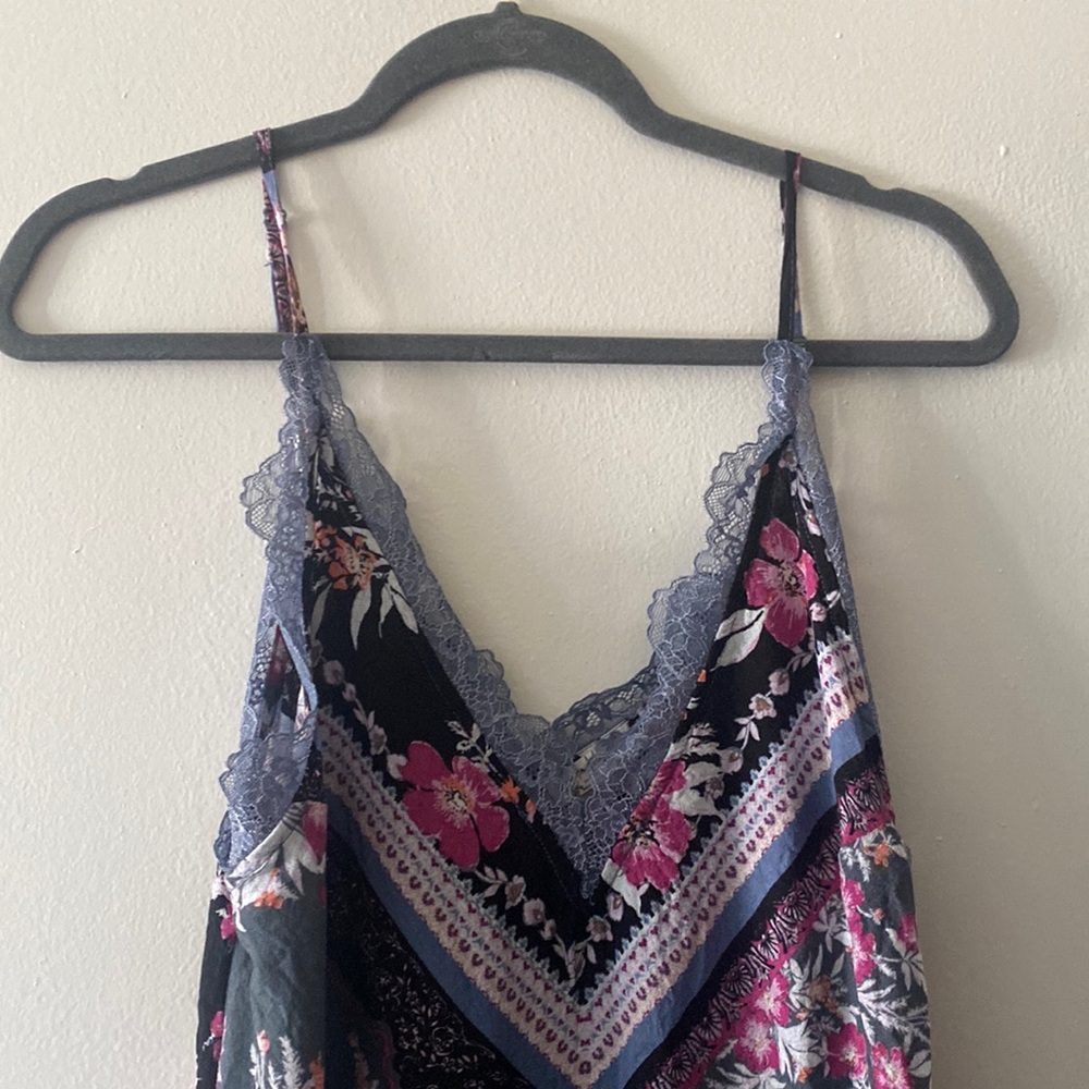 Free people slip New condition purples pinks and blacks with lace v neck